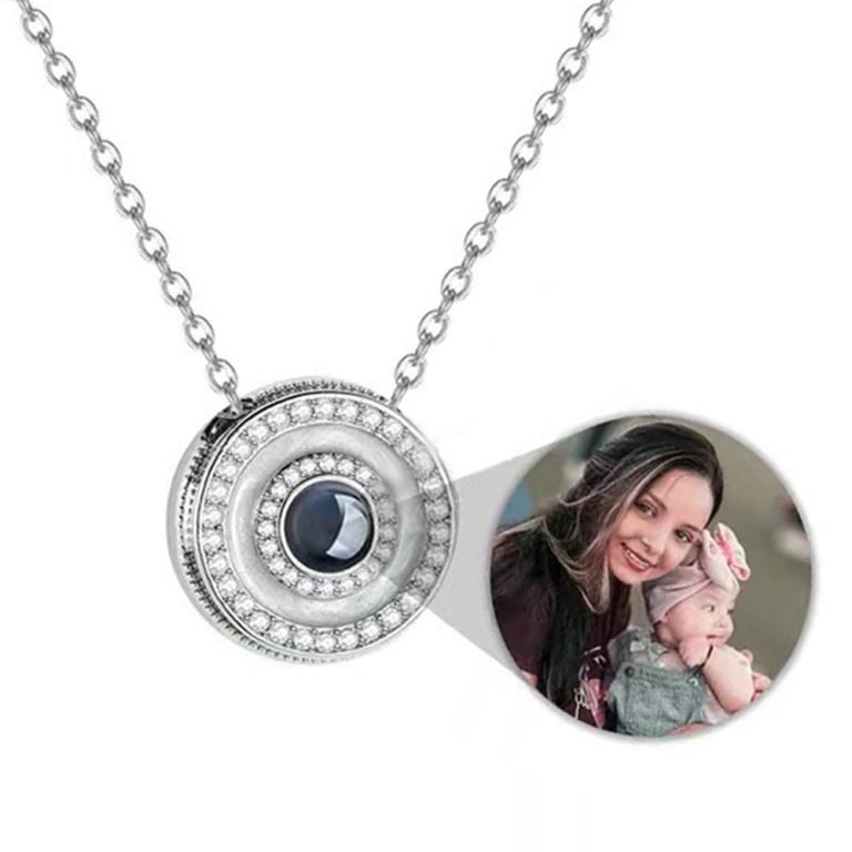 circle photo projection necklace in 18K gold plating showing a hidden picture of mother and baby